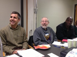 Steve, Dave, and Dillibe listen to Nicole's speech