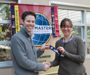 Guest, Michelle, receives the "best table topics" ribbon