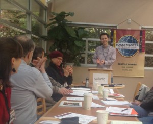 Scott leads the applause at the start of the meeting