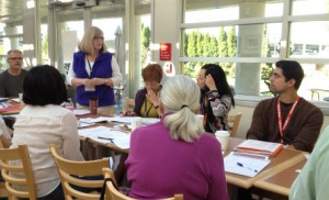 Members listen to a table topics response