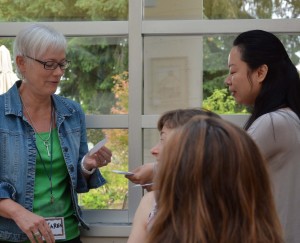 Karen selects another song title for Table Topics.