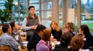 Shen explains his role as timer for the meeting.