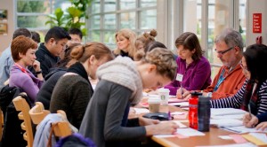 Everyone takes a moment to write feedback for Petra on her speech.