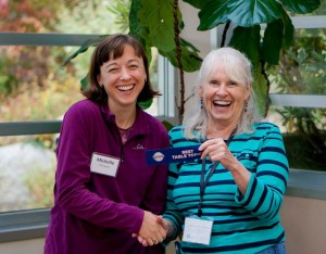 Madeleine presents a ribbon to Michelle.