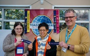 Katey and Mark receive ribbons as best evaluators.