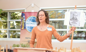Toastmaster Nancy reads from a yard sign